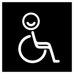 Mustavalkoinen opaste invavessaan. Mustan neliön keskellä on pyörätuolisymboli ja hymyilevä hahmo.
